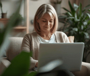 Therapist reviewing an AI-generated therapy session note on a laptop in a US private practice office