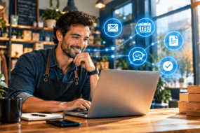 Small business owner using AI workflow automation for small business on a laptop with connected workflow icons